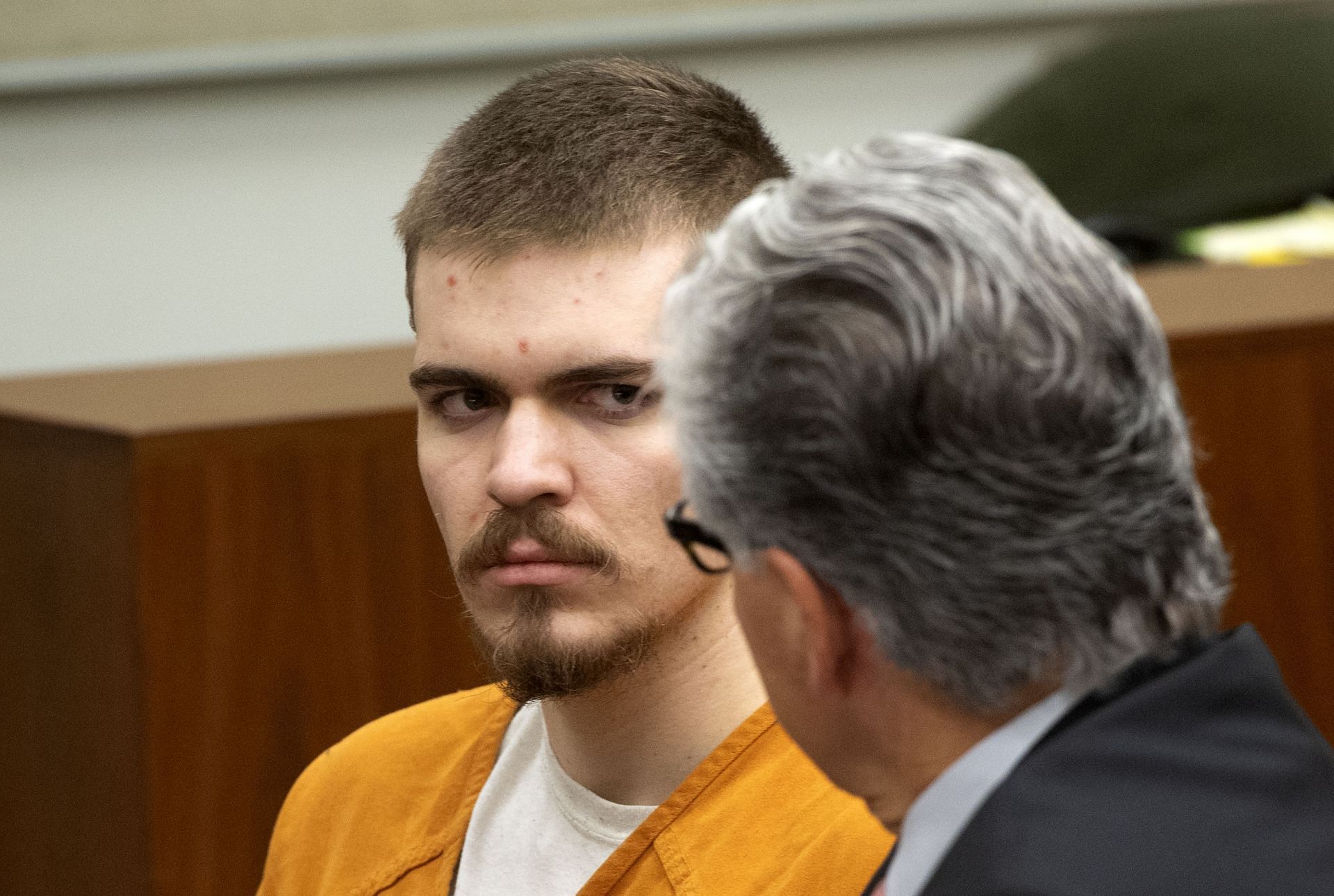 Samuel Woodward talks to his attorney Edward Munoz during a court hearing. (Image via Getty)